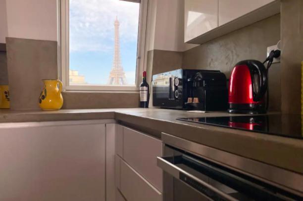 Les Toits De Rue Cler Vue Tour Eiffel Apartamento Paris