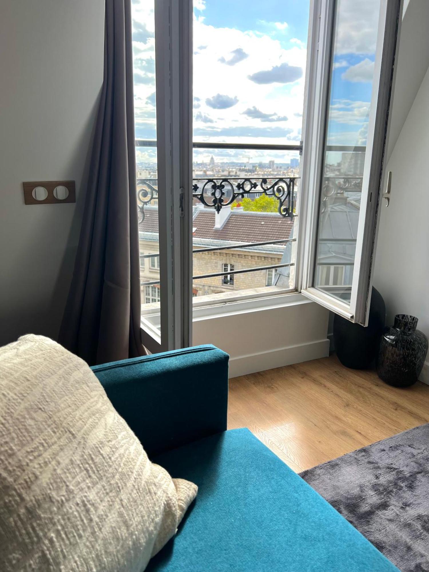With Fabulous View On Roofs Homestay Paris